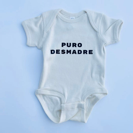 puro desmadre onesie